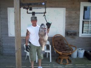 Happy customer and his catch on the dock at Whale Creek Marina in 2011