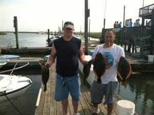 Photos of customers with their catch on the dock at Whale Creek Marina in 2012