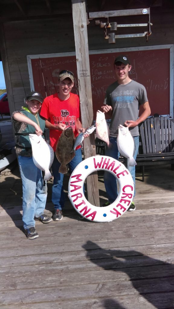 customers with their catch on the dock at Whale Creek Marina