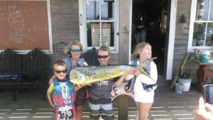 kids and their catch on the dock at Whale Creek Marina